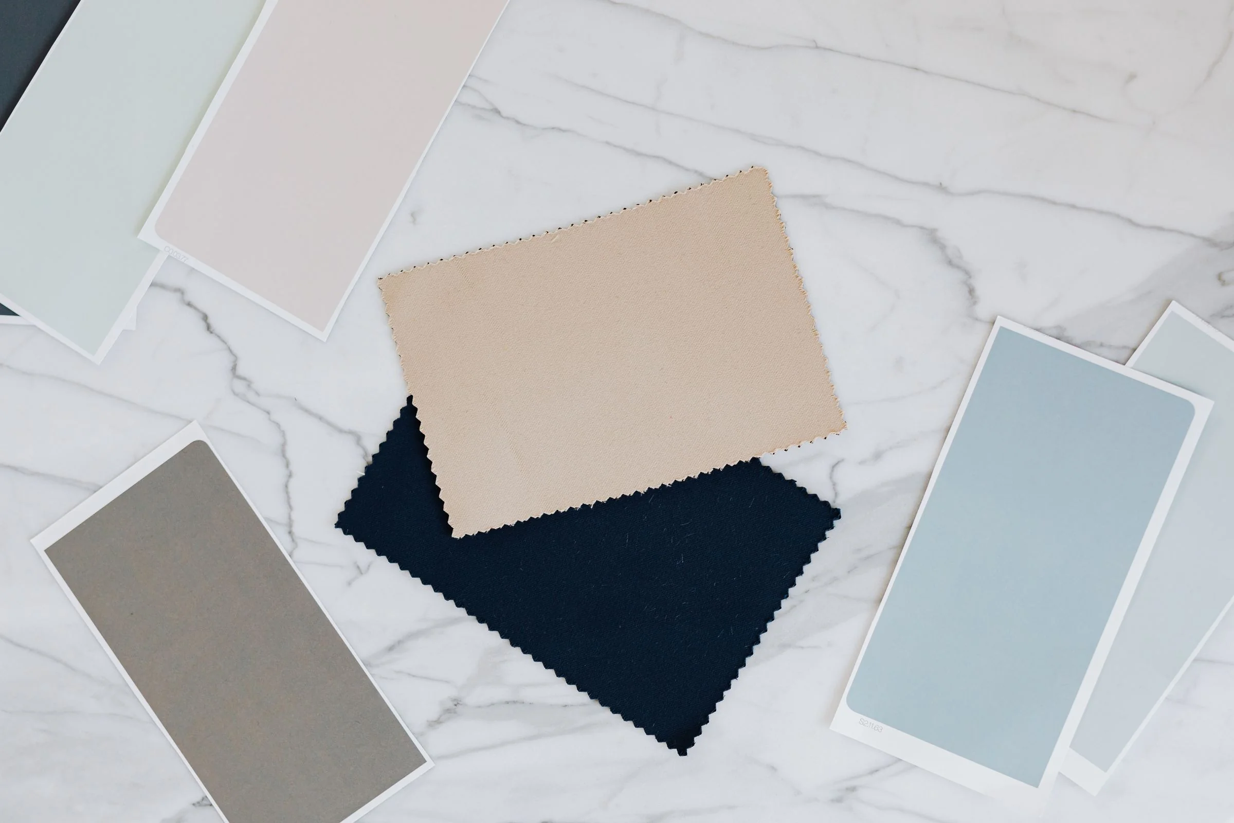 Fabric and color samples organized before a Canton Fair and Foshan furniture sourcing trip