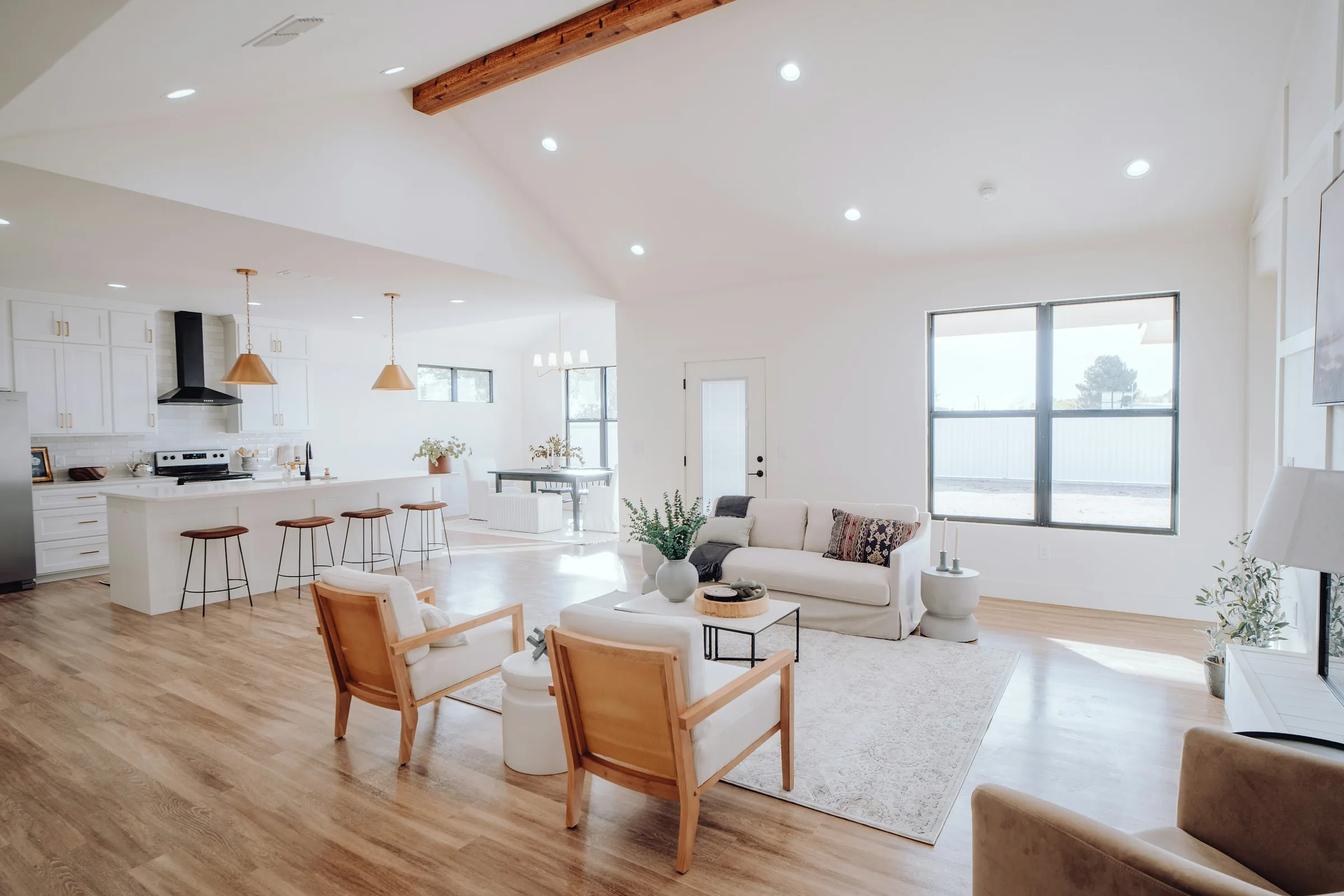 Open-plan living room and kitchen representing coordinated whole-home project sourcing