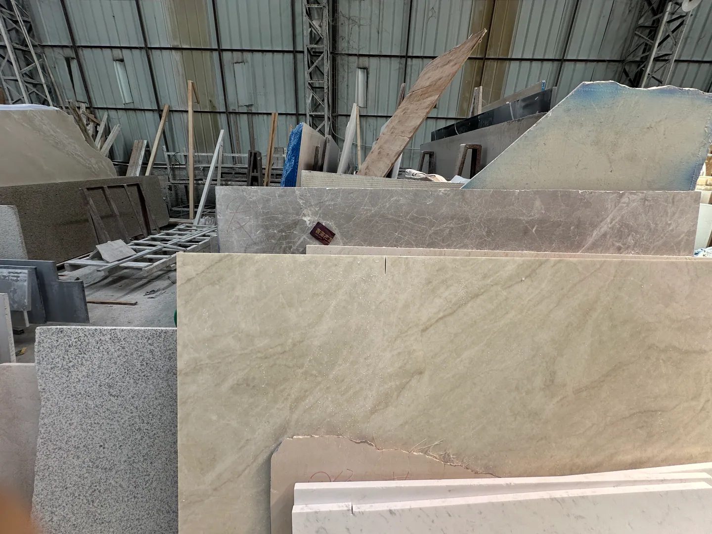 Stone surface checked against project requirements during building material supplier follow-up