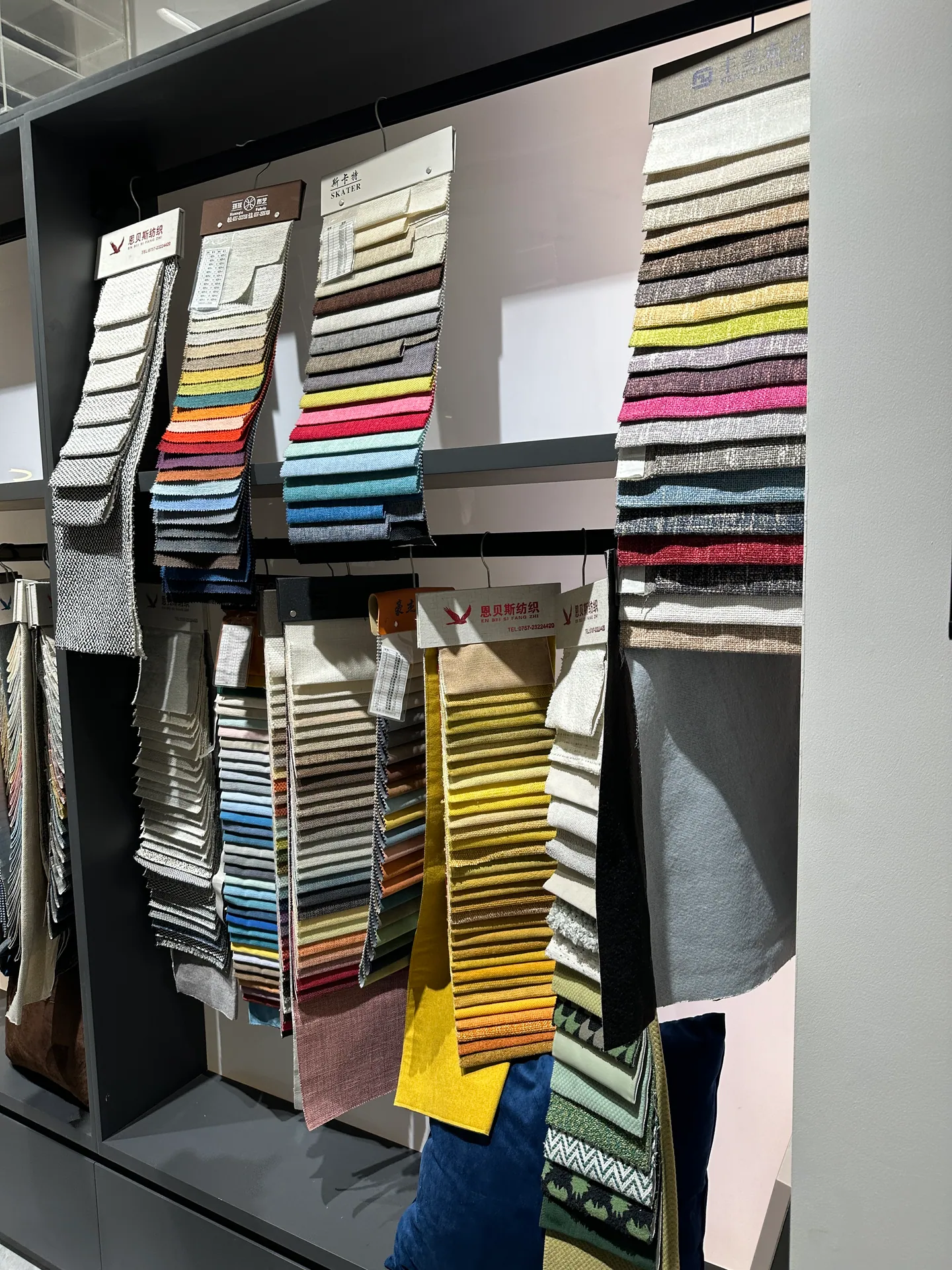 Upholstery fabric swatches evaluated for furniture and FF&E sourcing in Foshan